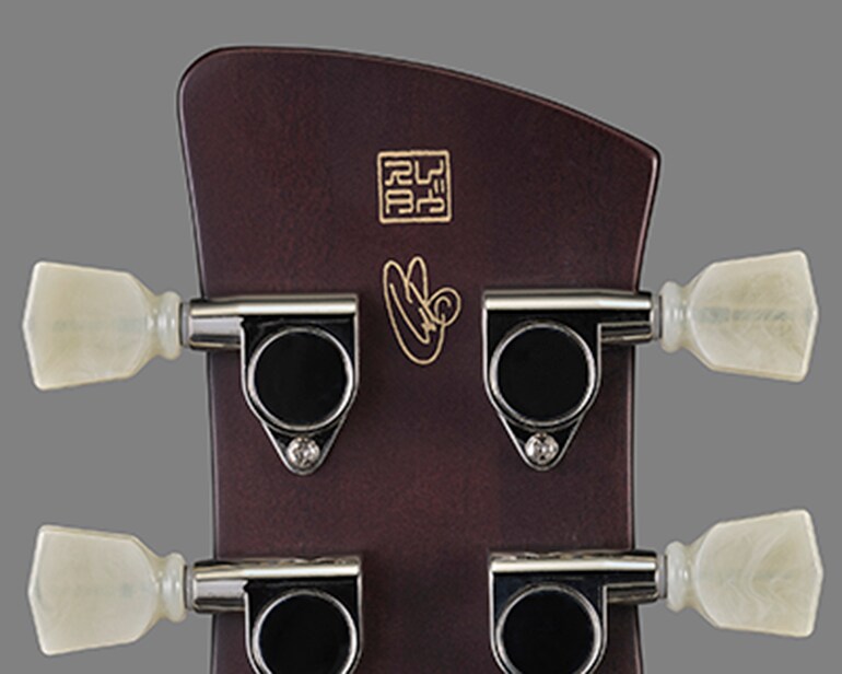 Signature engraving on the back of the headstock of the Signature Revstar RS02CB