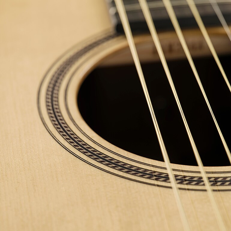 Close-up of a rope-shaped soundhole inlay, a motif deeply rooted in Japanese culture.