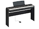 Diagonal side view of the P-125aB (black model) in combination with the optional stand and sustain pedal
