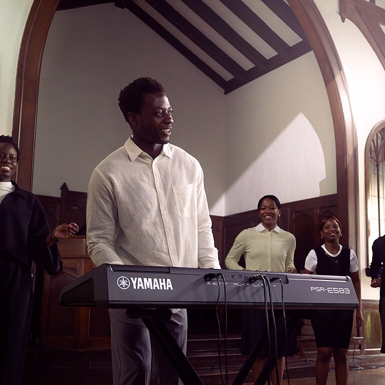 A person playing Yamaha Portable Keyboard PSR-E583 in the Church