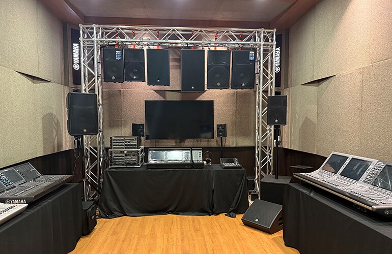 Kuala Lumpur training facility room with stage area, seating, and audio equipment.